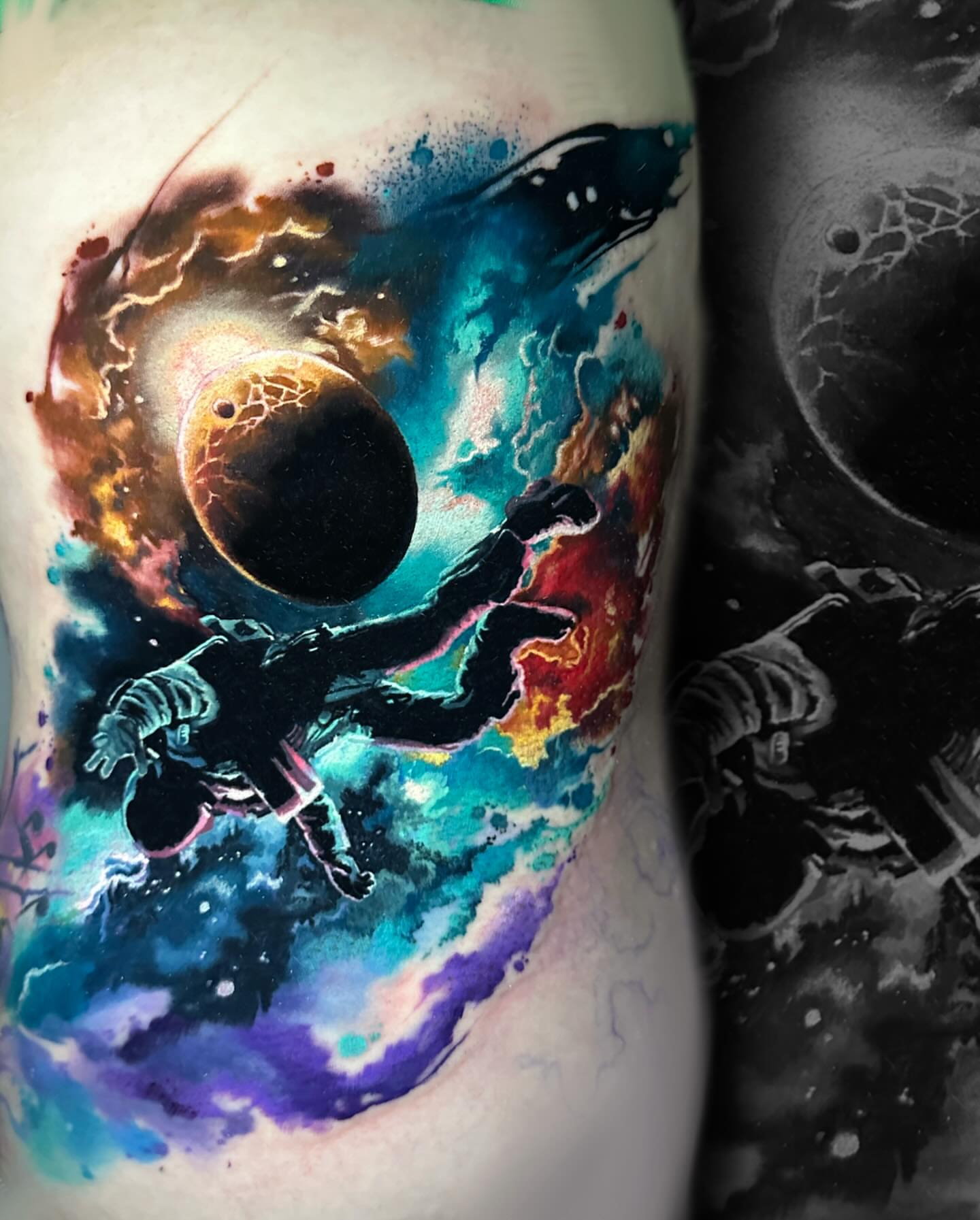 Astronaut in space watercolor tattoo on the upper arm by Mike Shultz