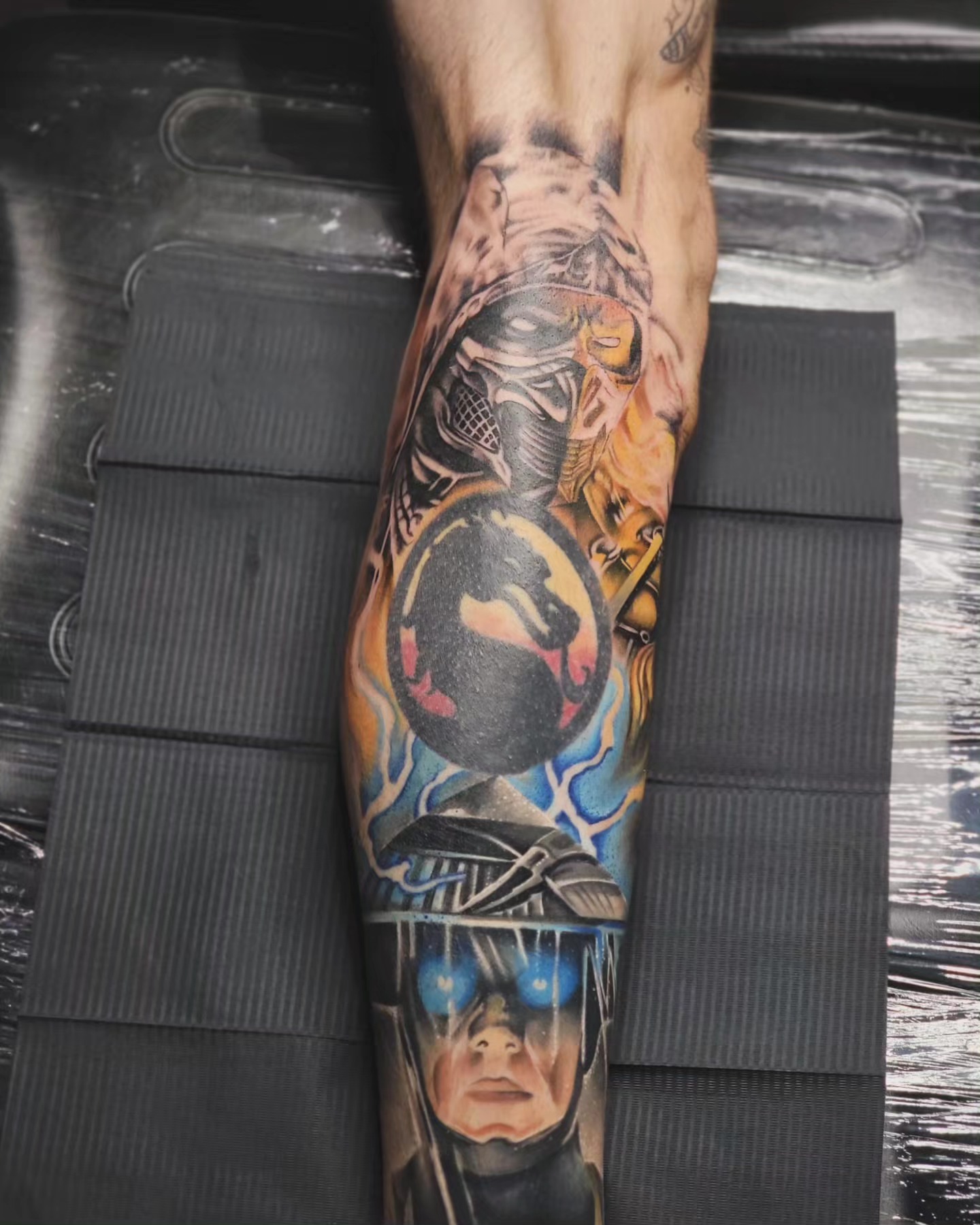 Anime characters anime tattoo on the forearm by Mark Melanson
