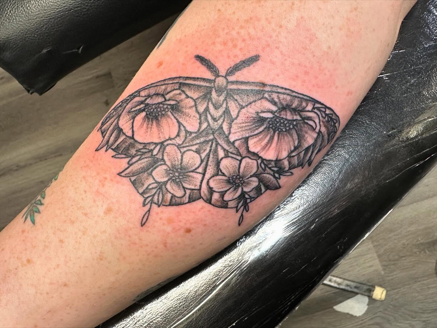Moth with floral wings black and grey tattoo on the forearm by Madeline, Akron, Ohio