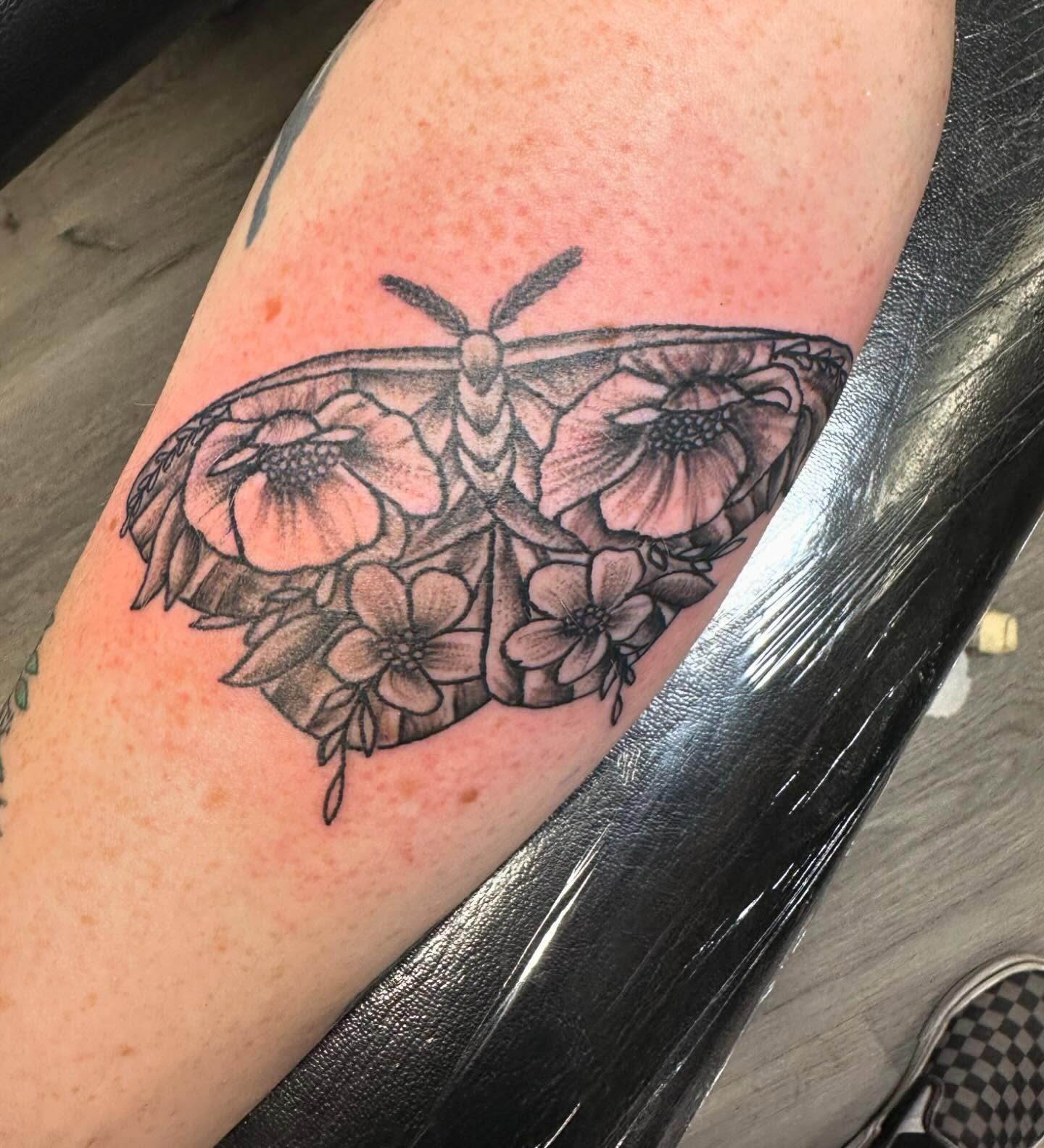 Moth and flowers black and grey tattoo on the forearm by Madeline, Akron, Ohio