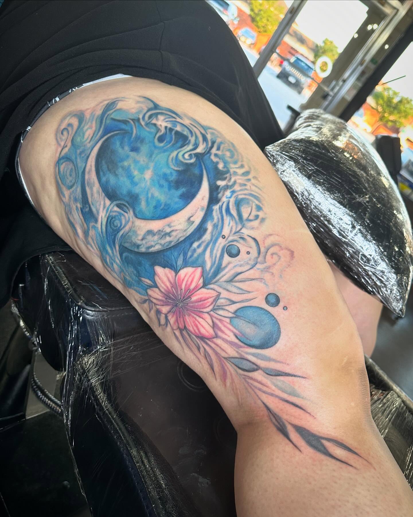 Moon and flower new school tattoo on the thigh by Cameron Hobbs, Woodbridge, Virginia