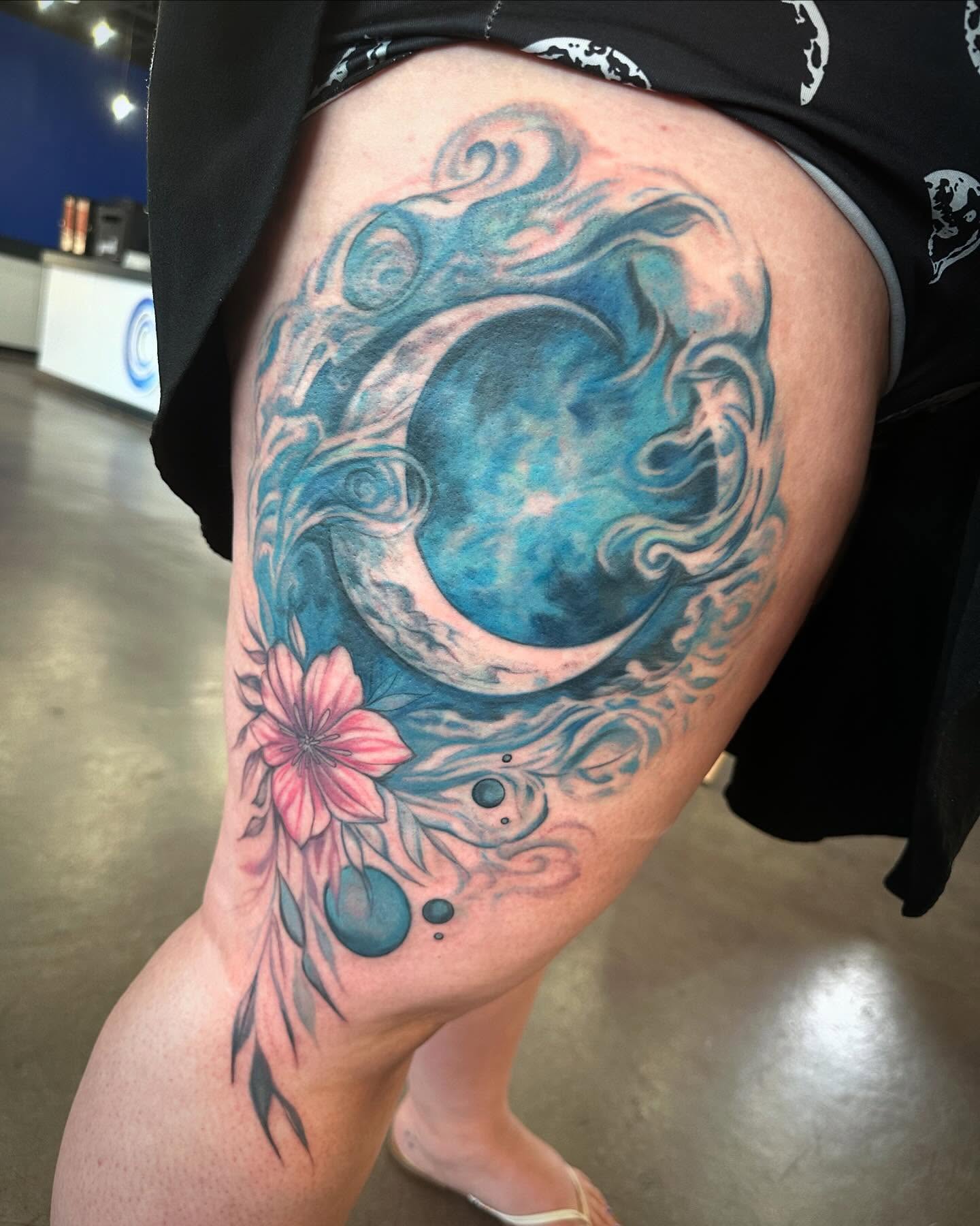 Moon and flower new school tattoo on the thigh by Cameron Hobbs, Woodbridge, Virginia