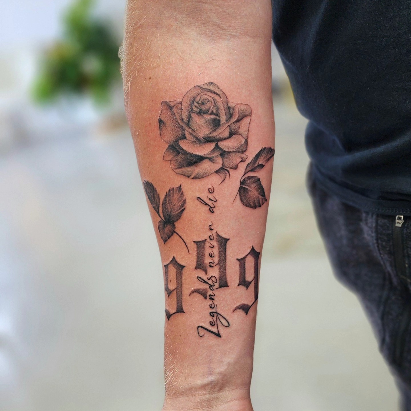 Rose and lettering realism tattoo on the forearm by Diane Maya