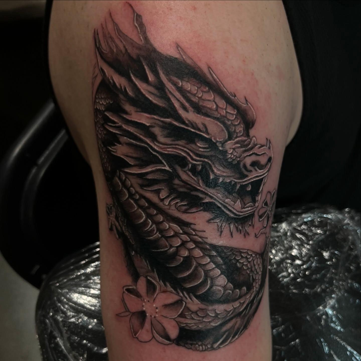 Dragon realism tattoo on the thigh by Therapy ink