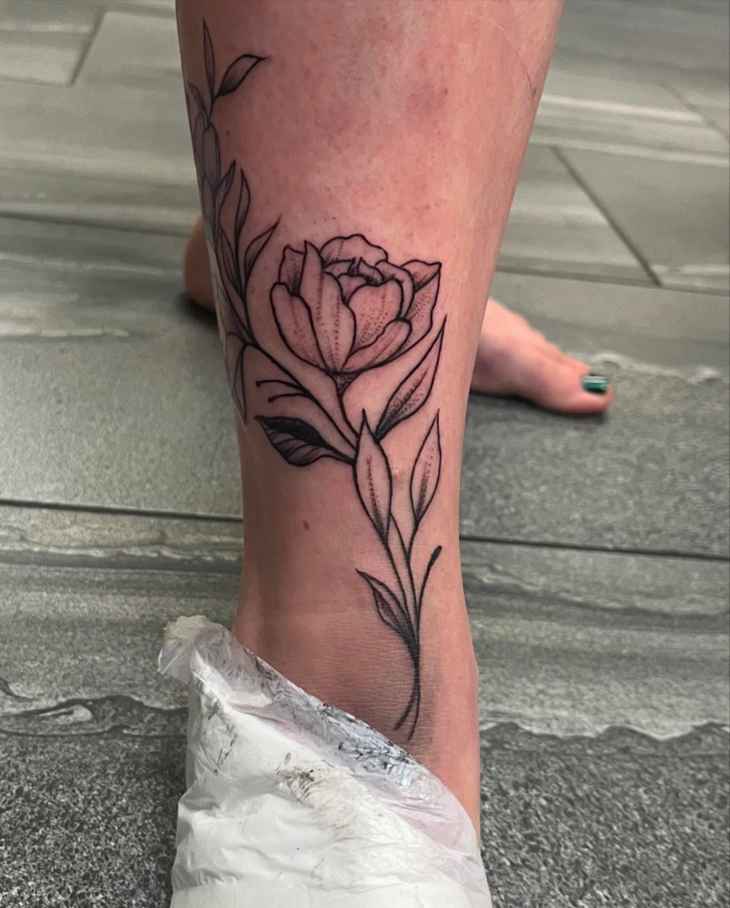 Rose black and grey tattoo on the calf by Missy (Miz)
