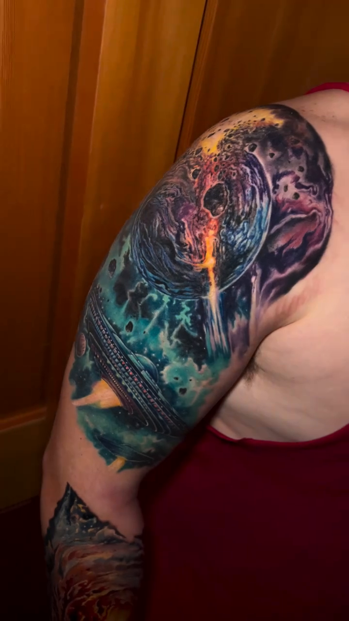 Cosmic scene with planets and nebula realism tattoo by Timmy Ickes
