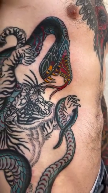 Tiger and snake japanese irezumi tattoo by Kayle Leogrande