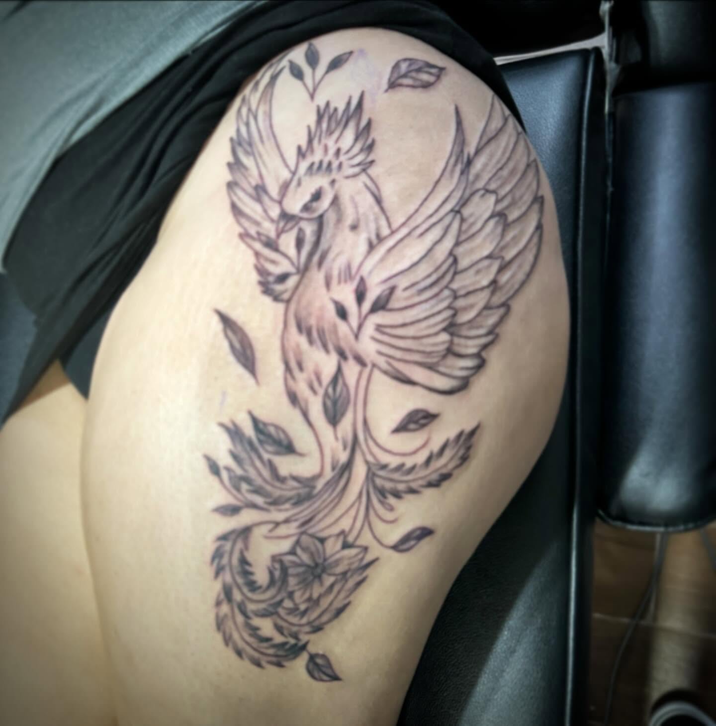 Phoenix black and grey tattoo on the thigh by Erasmo Vasquez