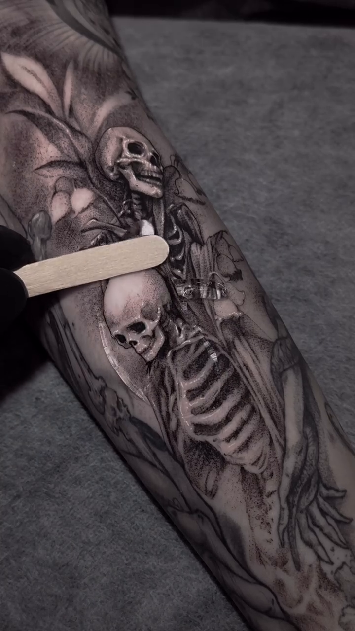 Skeletons and foliage dark realism tattoo by Gregorio Devera