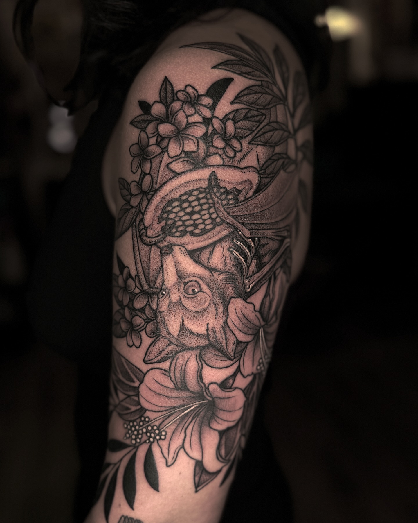 Fish and flowers dotwork tattoo on the forearm by Kyle Stacher - Blackwork Tattoos - Denver
