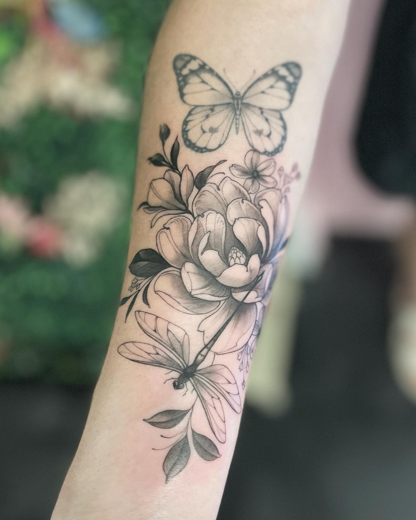 Butterfly and flowers realism tattoo on the forearm by π‘πΆπΈπ½ππ ππΎππππ