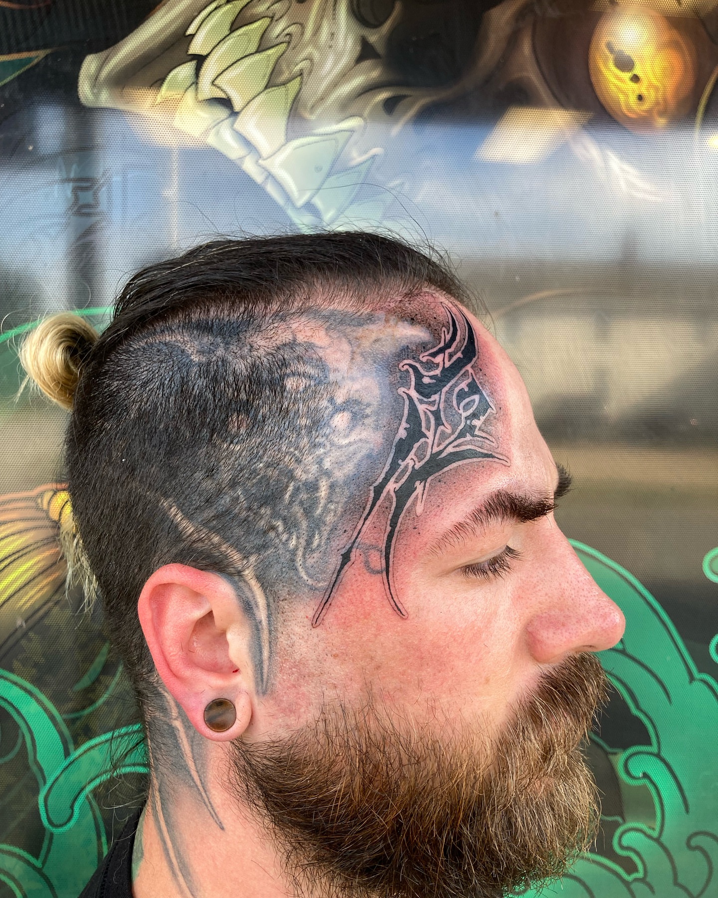 Abstract design black and grey tattoo on the head by Griffin Benson