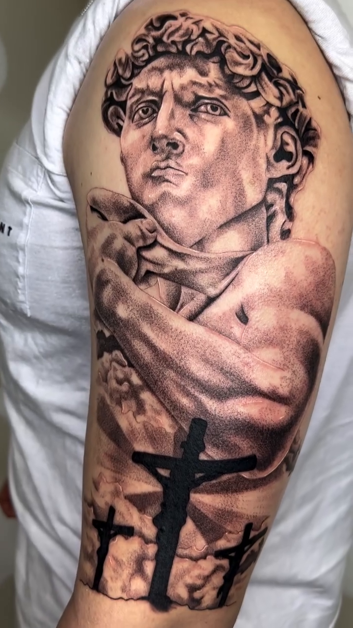 Bust of David with crosses realism tattoo by Mystikal Blue Casares