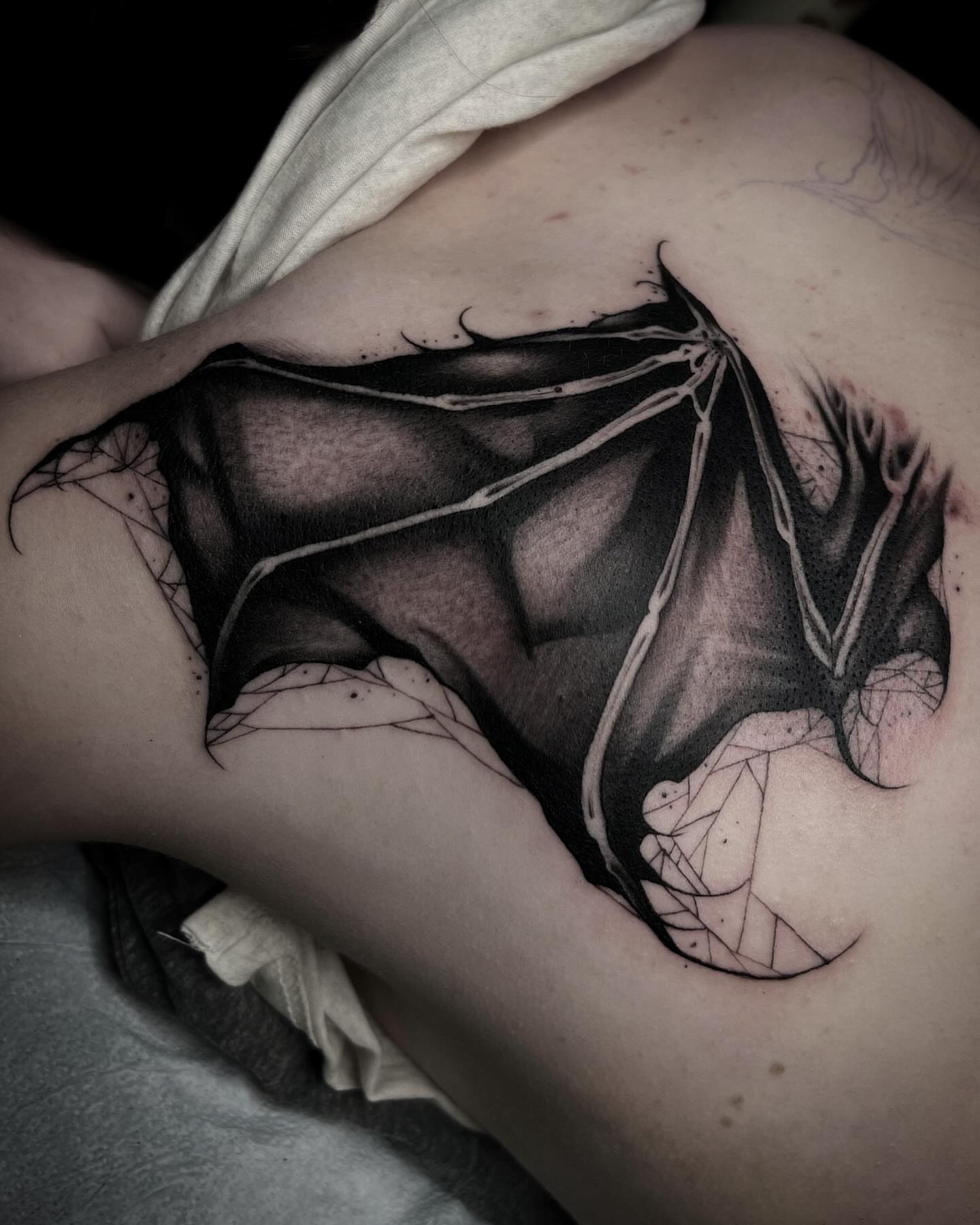 Bat geometric tattoo on the shoulder by 𝖎 𝖆𝖒 𝖗𝖔𝖙𝖙𝖎𝖓𝖌 𝖜𝖎𝖙𝖍 𝖞𝖔𝖚