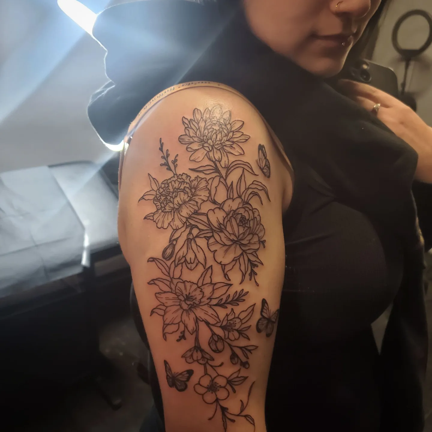 Floral bouquet black and grey tattoo on the shoulder by Shailey Pasquale