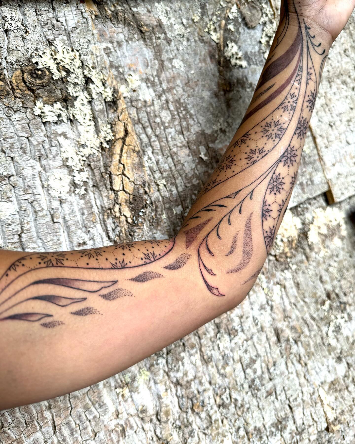 Floral pattern dotwork tattoo on the forearm by Ian Spencer