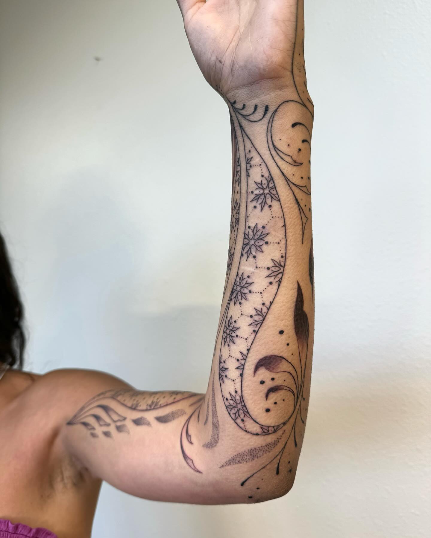 Floral vine dotwork tattoo on the forearm by Ian Spencer