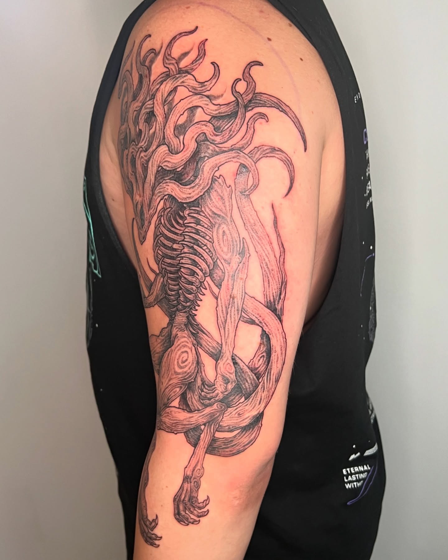Skeleton with tentacles realism tattoo on the upper arm by Vincent C DiBiaso, Covington, Kentucky