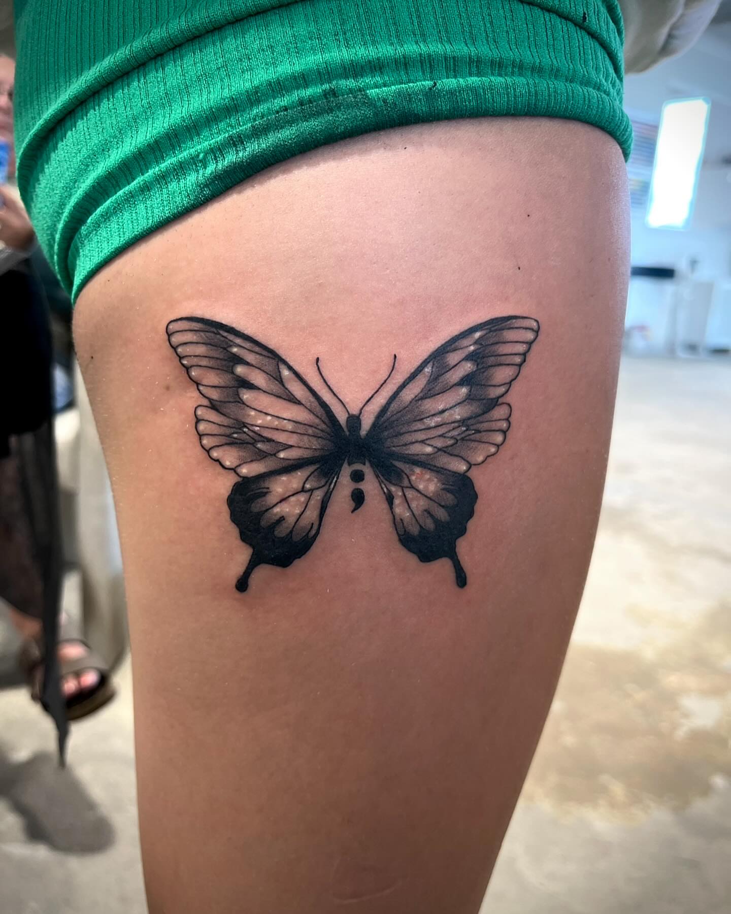 Butterfly black and grey tattoo on the thigh by Deville Pinson
