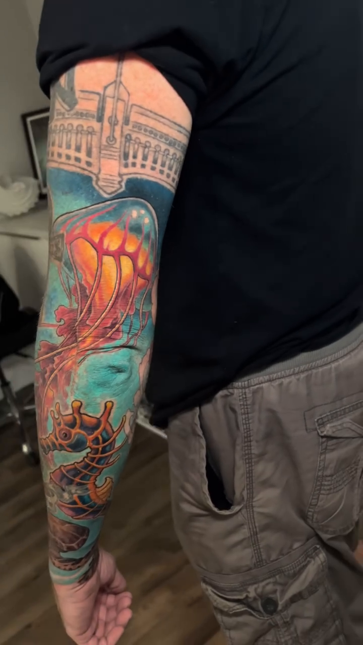 Underwater scene with jellyfish and diver realism tattoo by Marvin Silva