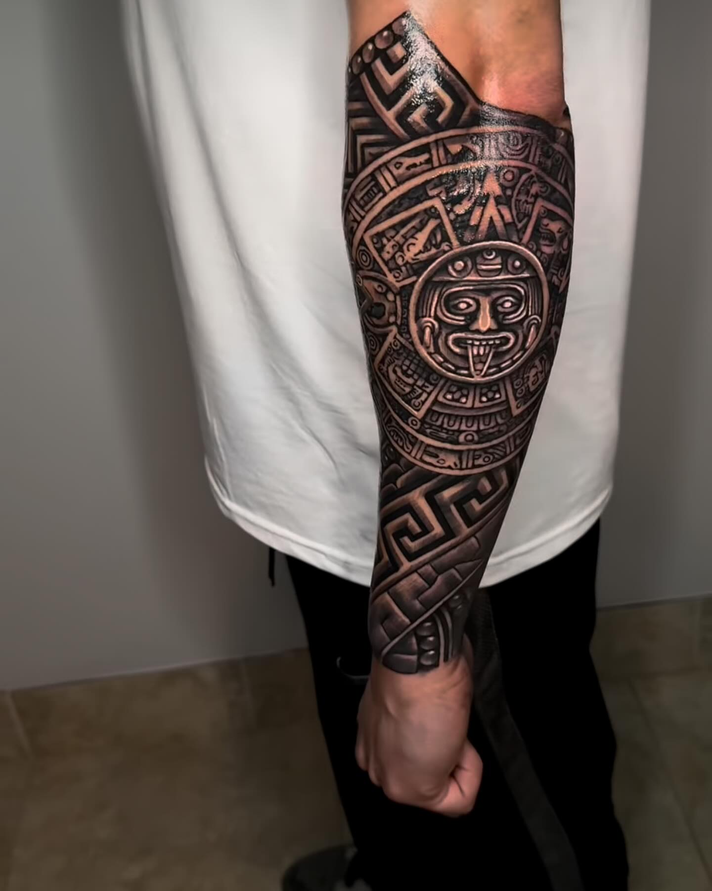 Astronaut mask geometric tattoo on the forearm by Luis Meneses
