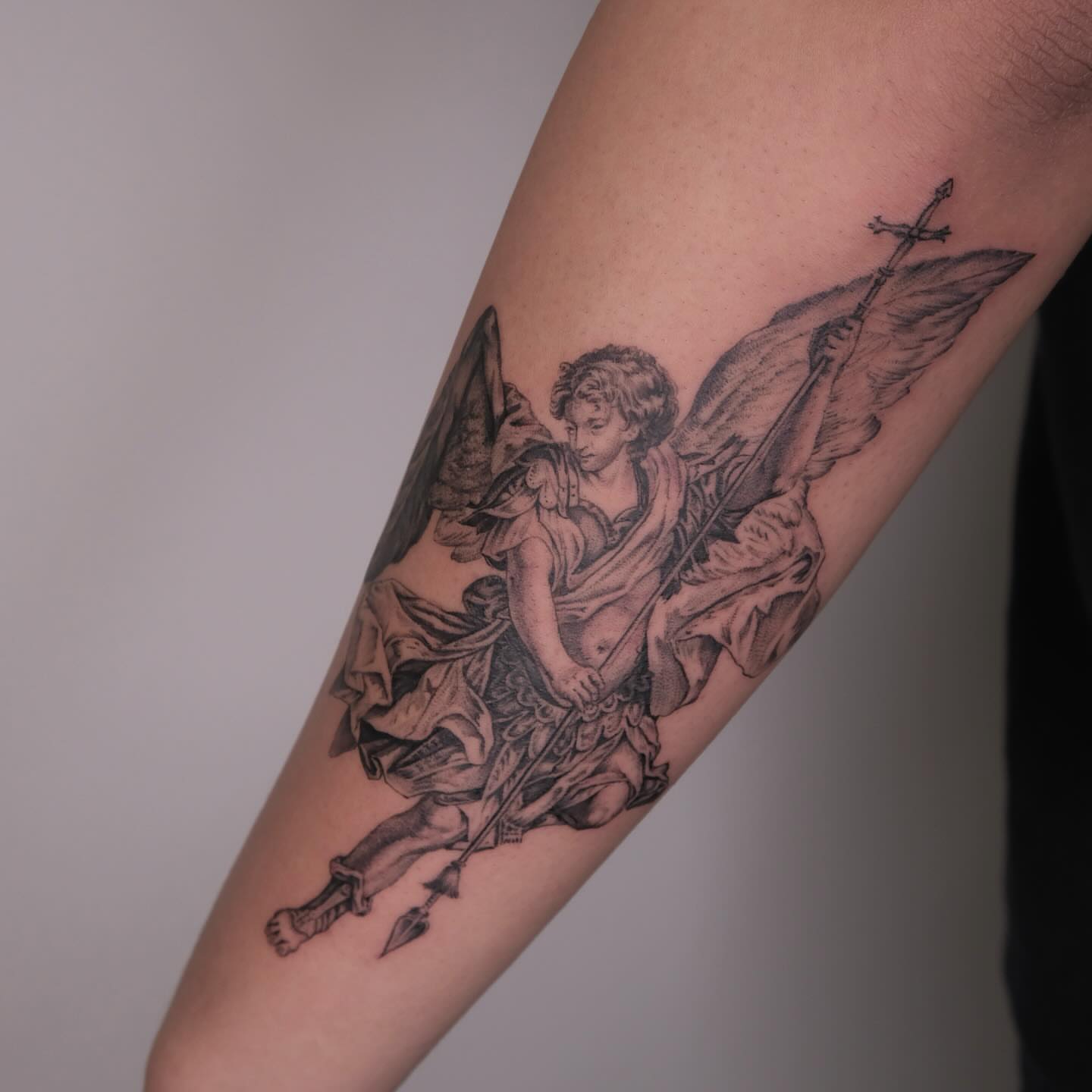 Angel with spear realism tattoo on the forearm by Zay - Realistic tattoo Artist