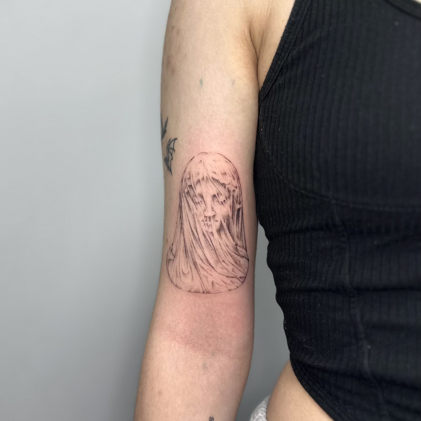 Ghostly figure realism tattoo on the forearm by ๐๐๐๐ ๐๐๐๐