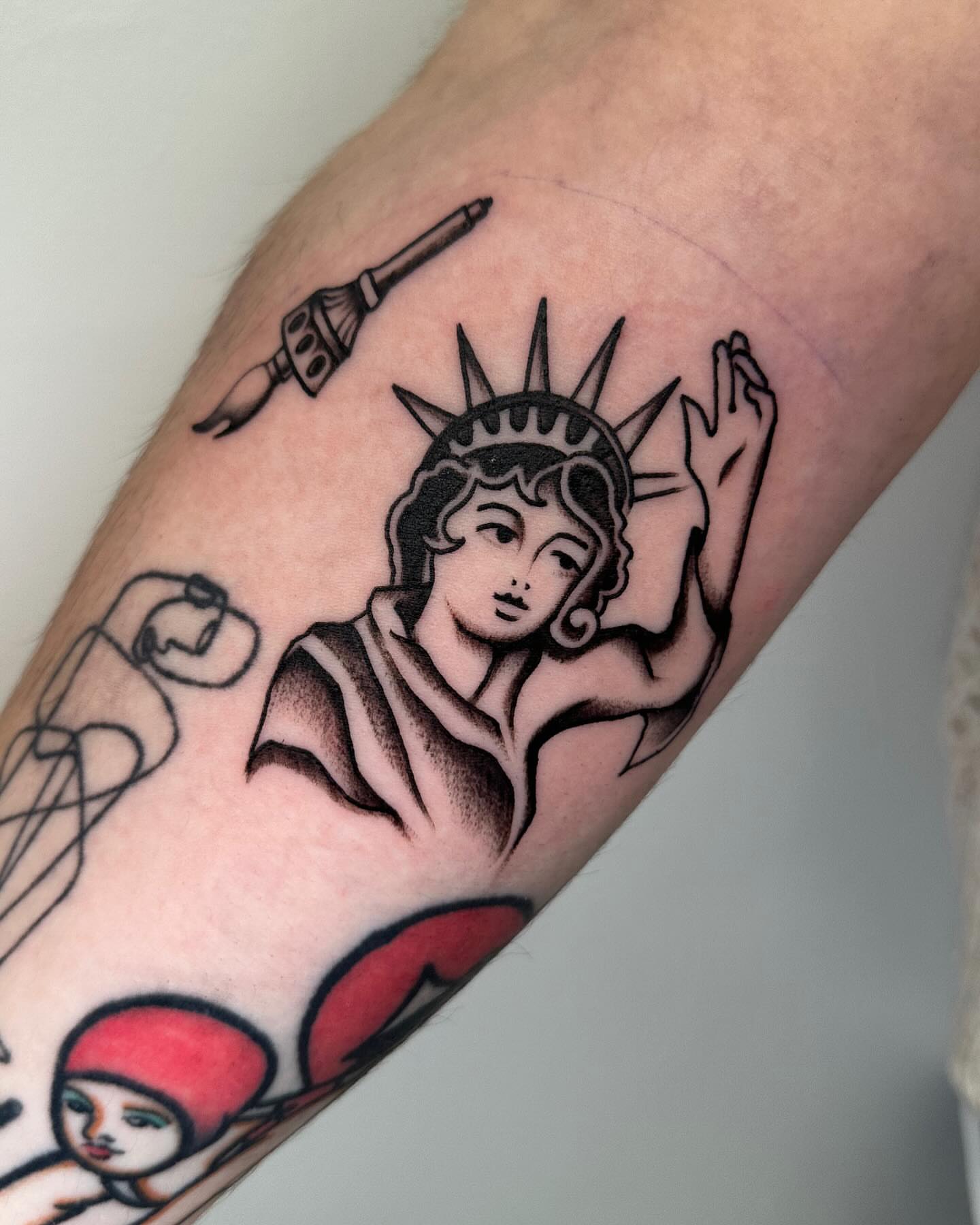 Statue of liberty American traditional tattoo on the forearm by ⠀Joey Rosado