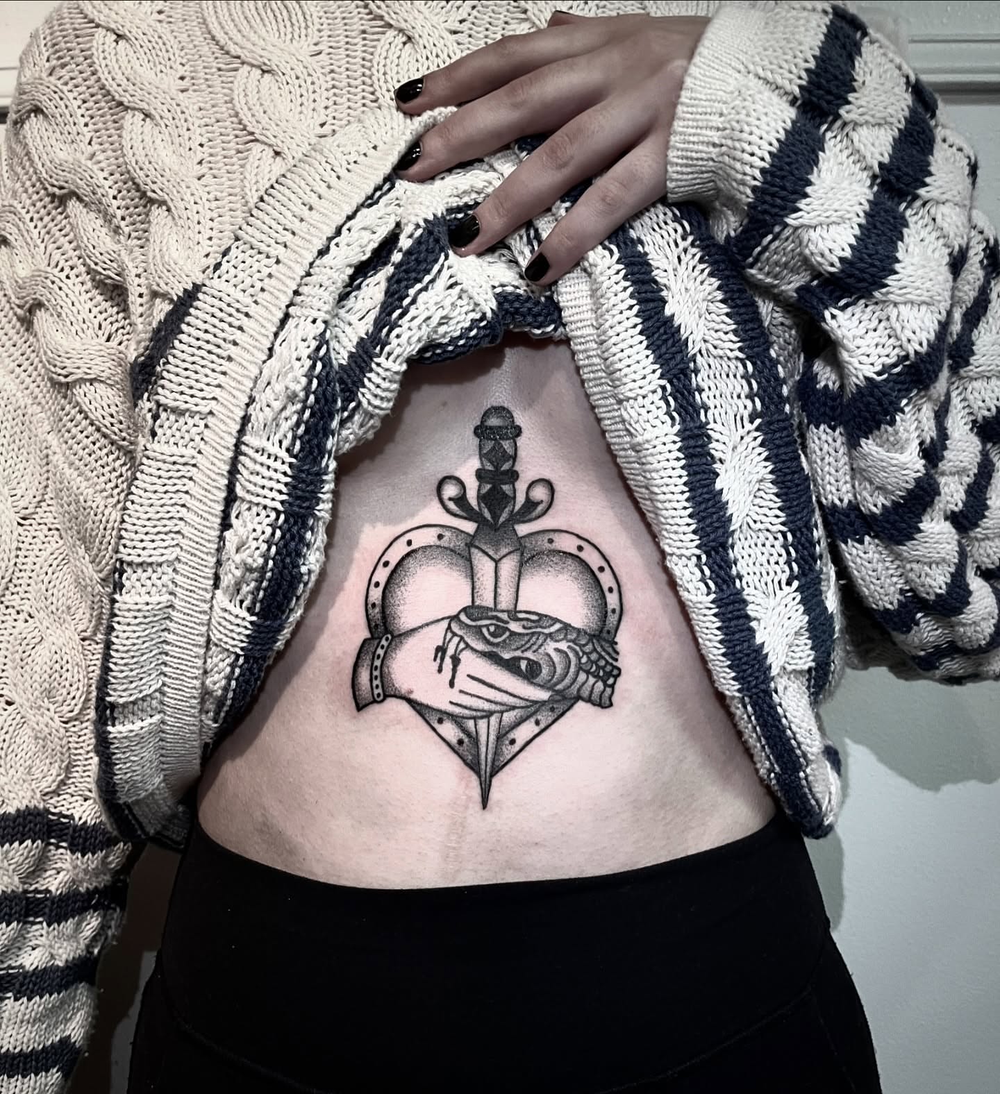 Heart with crown and sword dotwork tattoo on the ribs by Soorya ✨Seattle Tattoo Artist✨