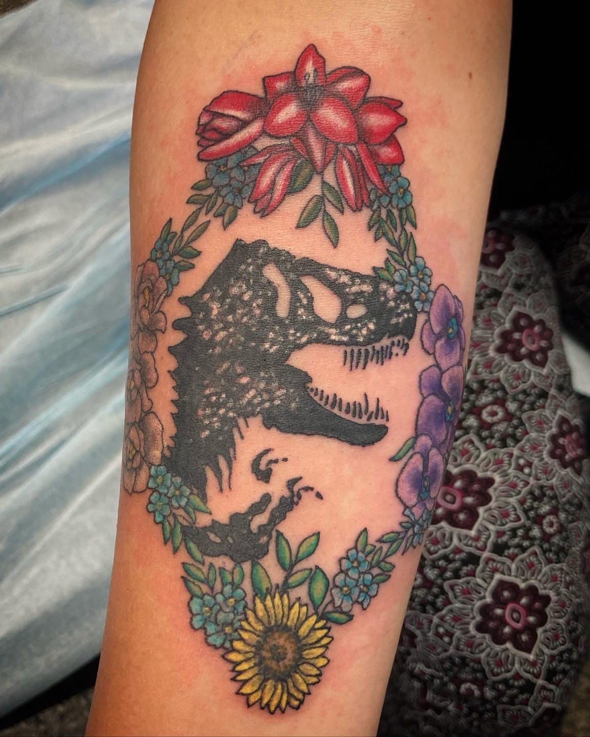 Wolf and flowers American traditional tattoo on the forearm by Madeline, Akron, Ohio