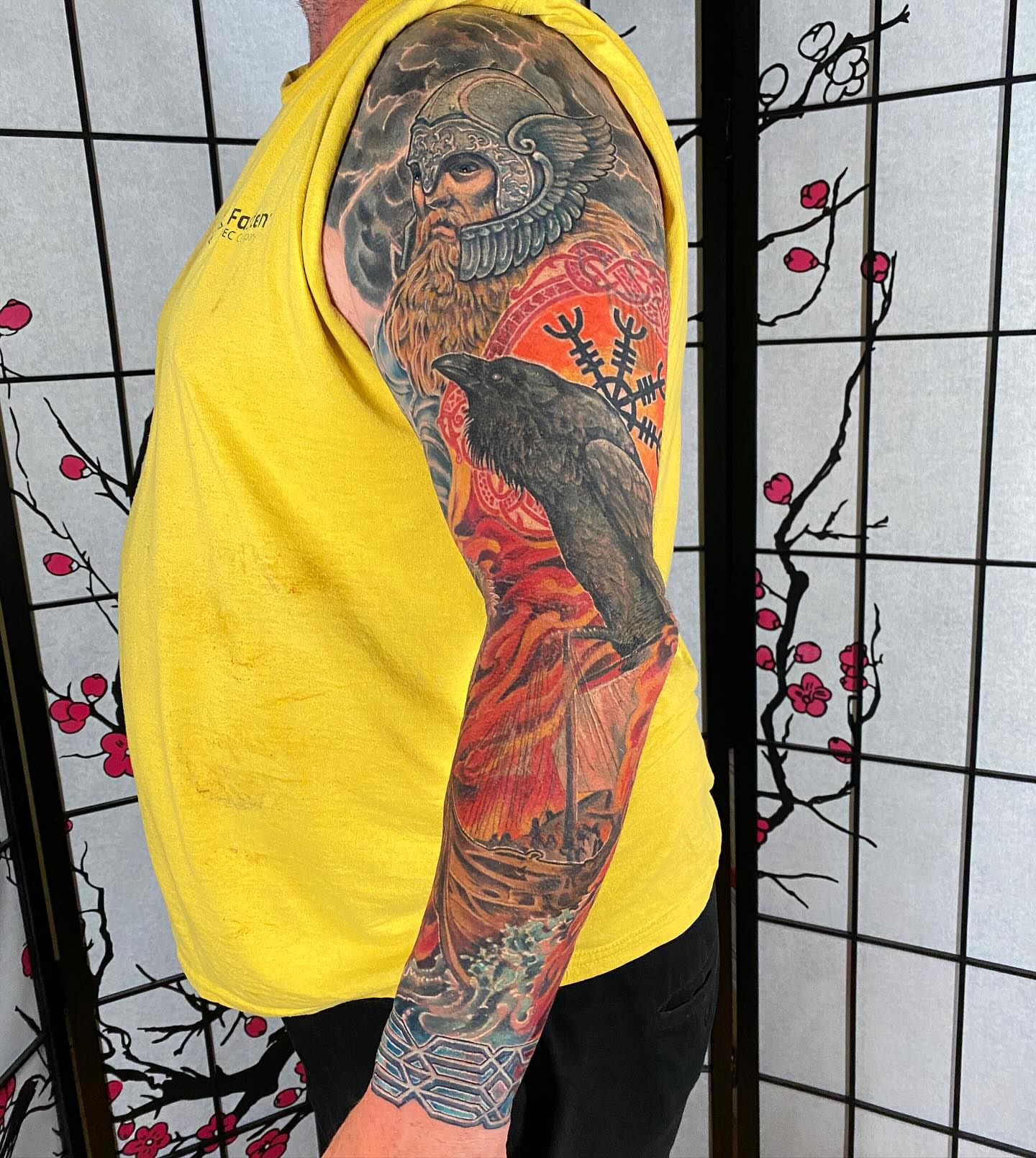 Viking warrior and raven American traditional tattoo on the upper arm by Eric James, Phoenix, Arizona
