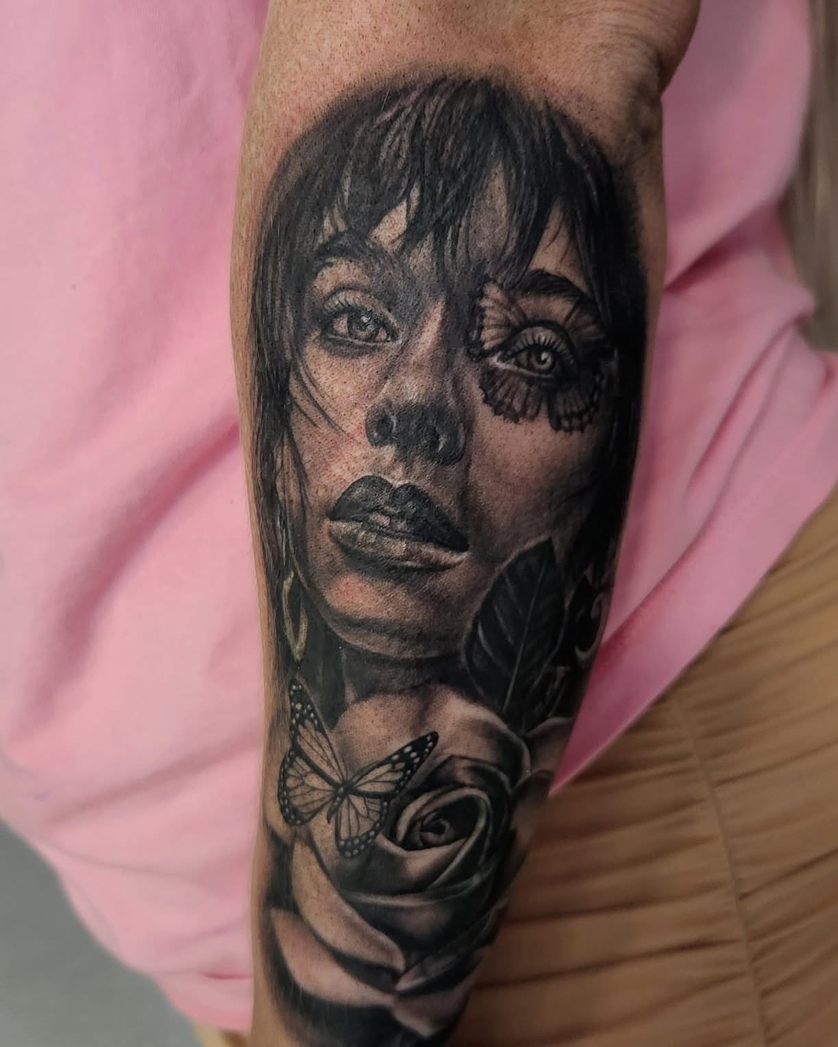 Woman's face realism tattoo on the forearm by Elidia Veliz