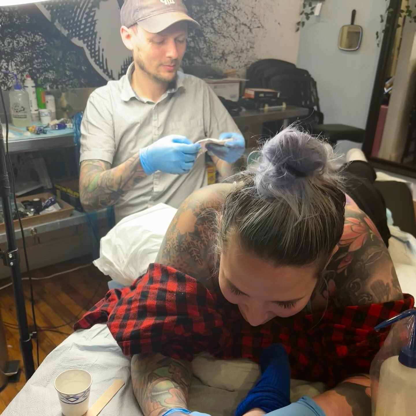 Floral design American traditional tattoo on the torso by Emmy Gallagher
