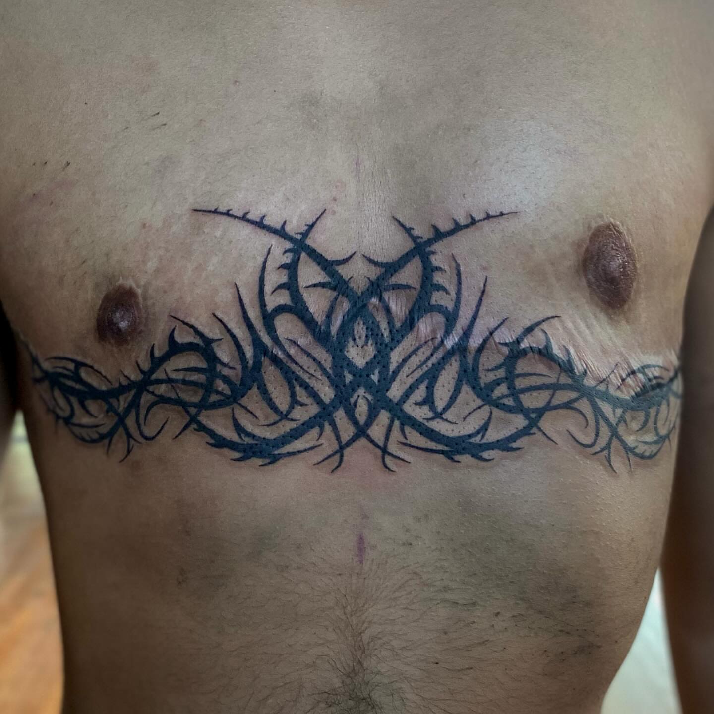 Thorn pattern tribal tattoo on the chest by Maddy ⁂, Murfreesboro, Tennessee