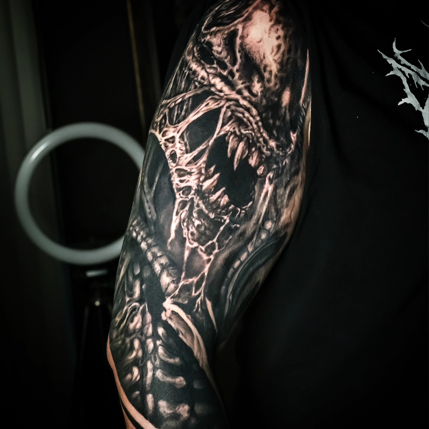 Dragon dark realism tattoo on the upper arm by Chicagoland Tattoo artist - Dany Rojas