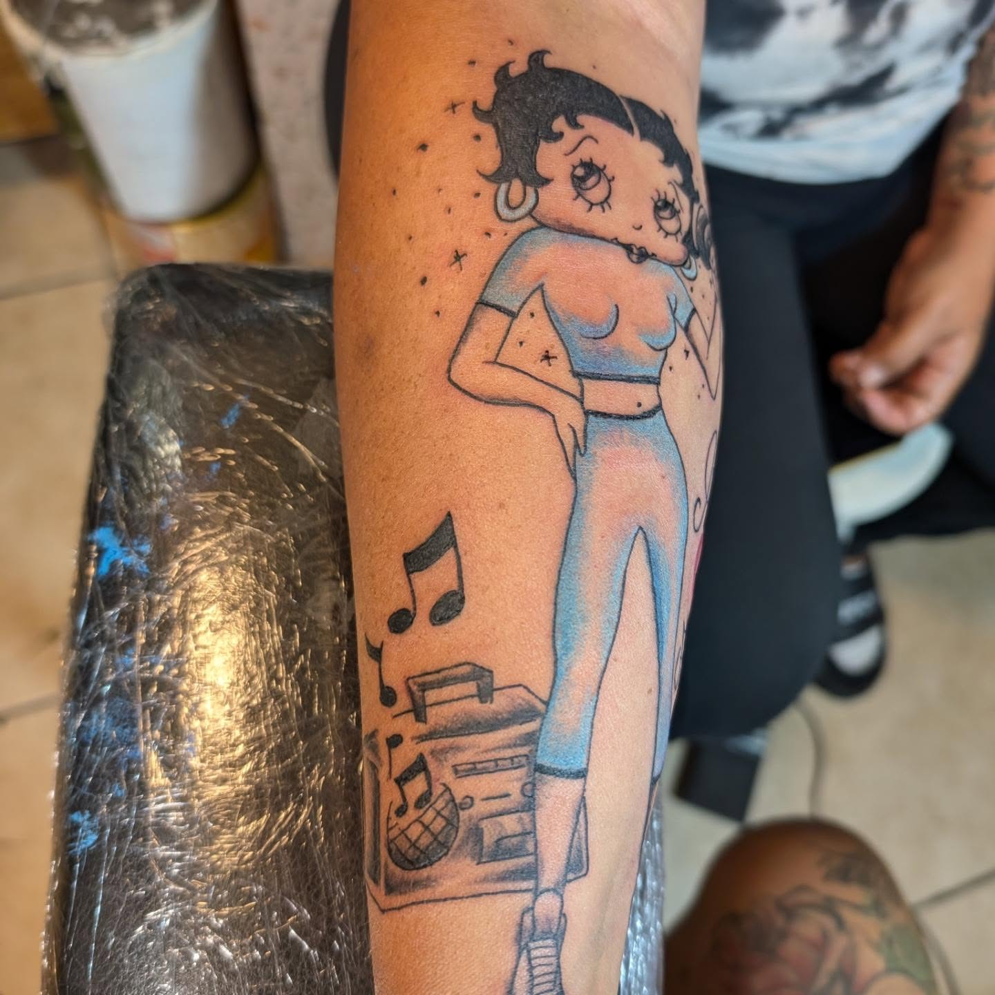 Betty Boop American traditional tattoo on the forearm by Markus Hicks