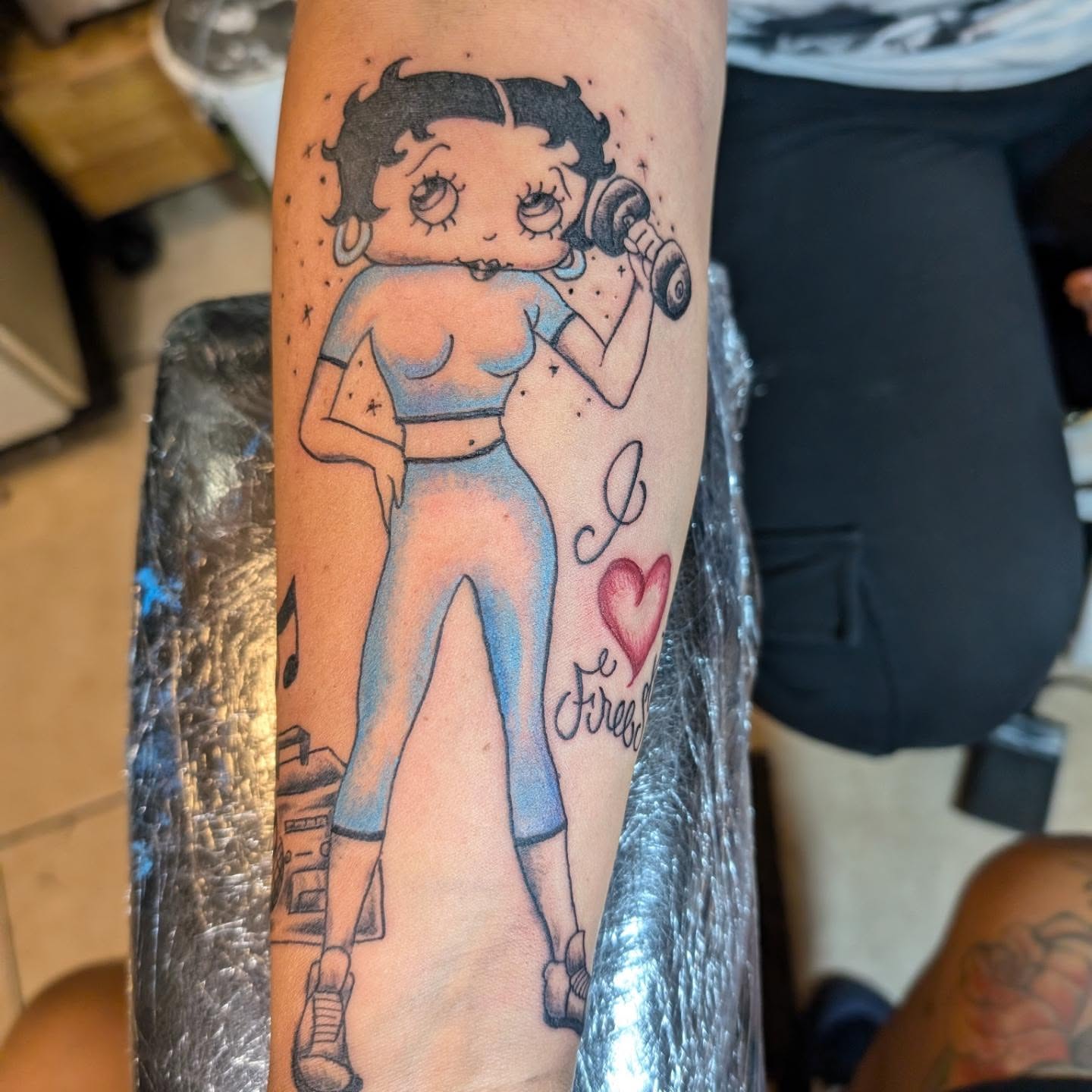 Betty Boop American traditional tattoo on the forearm by Markus Hicks