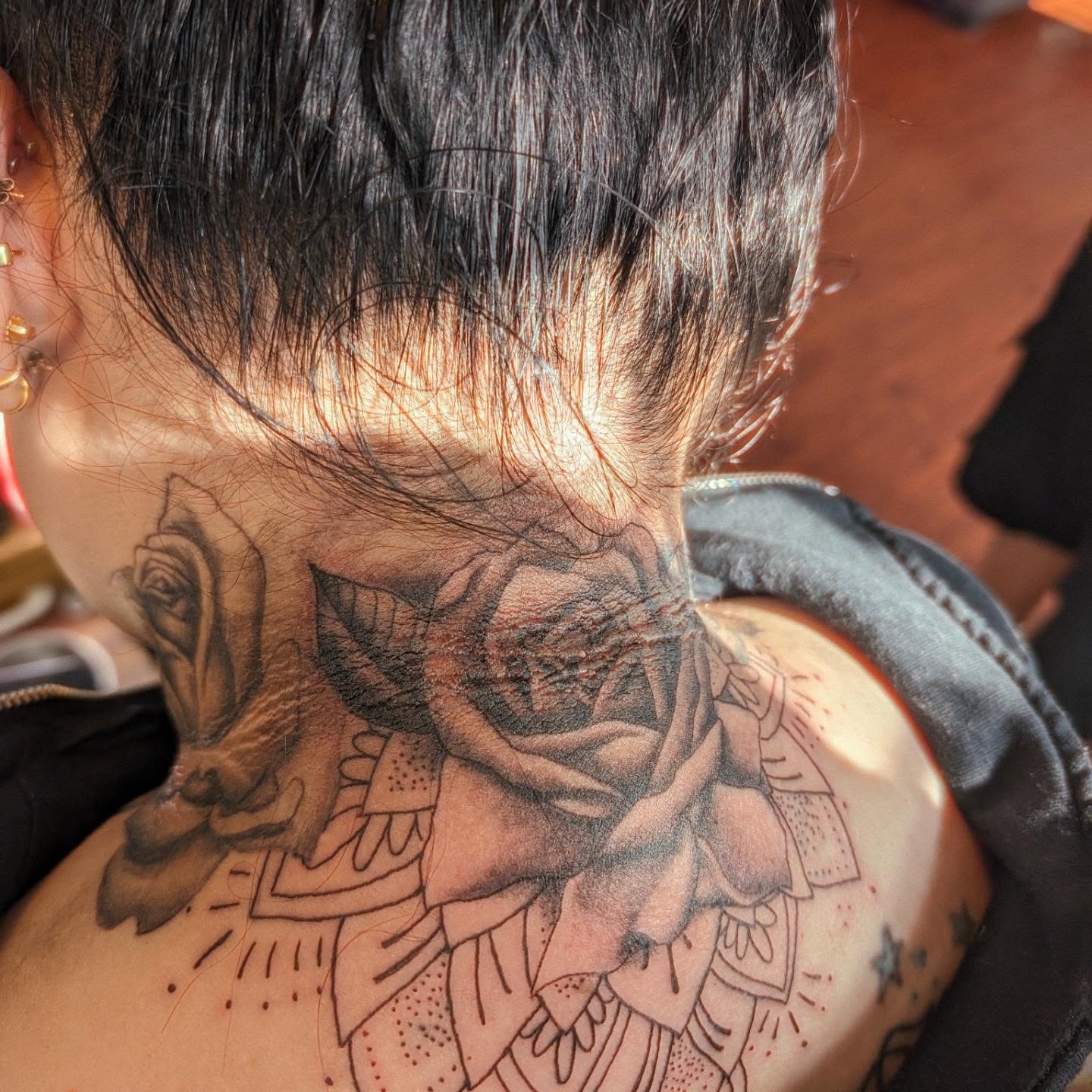 Rose realism tattoo on the neck by Markus Hicks