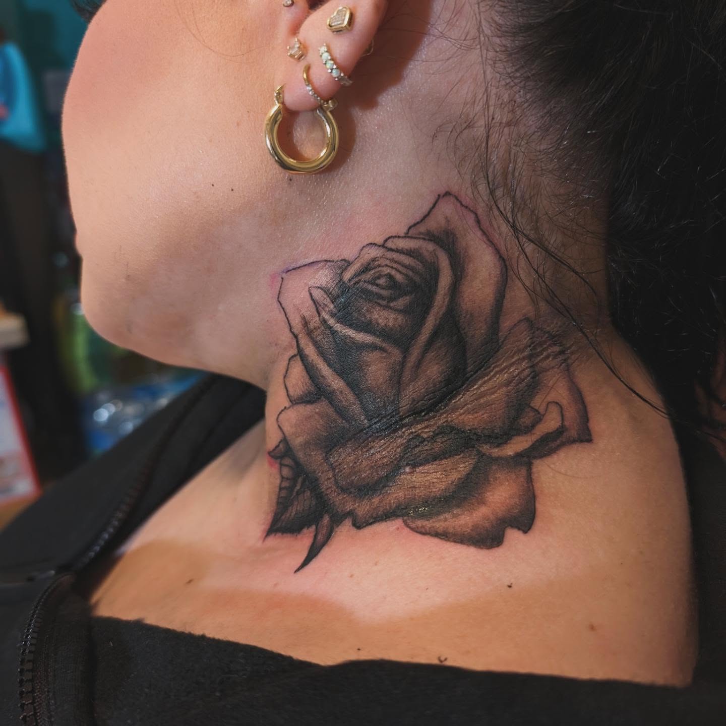 Rose realism tattoo on the neck by Markus Hicks