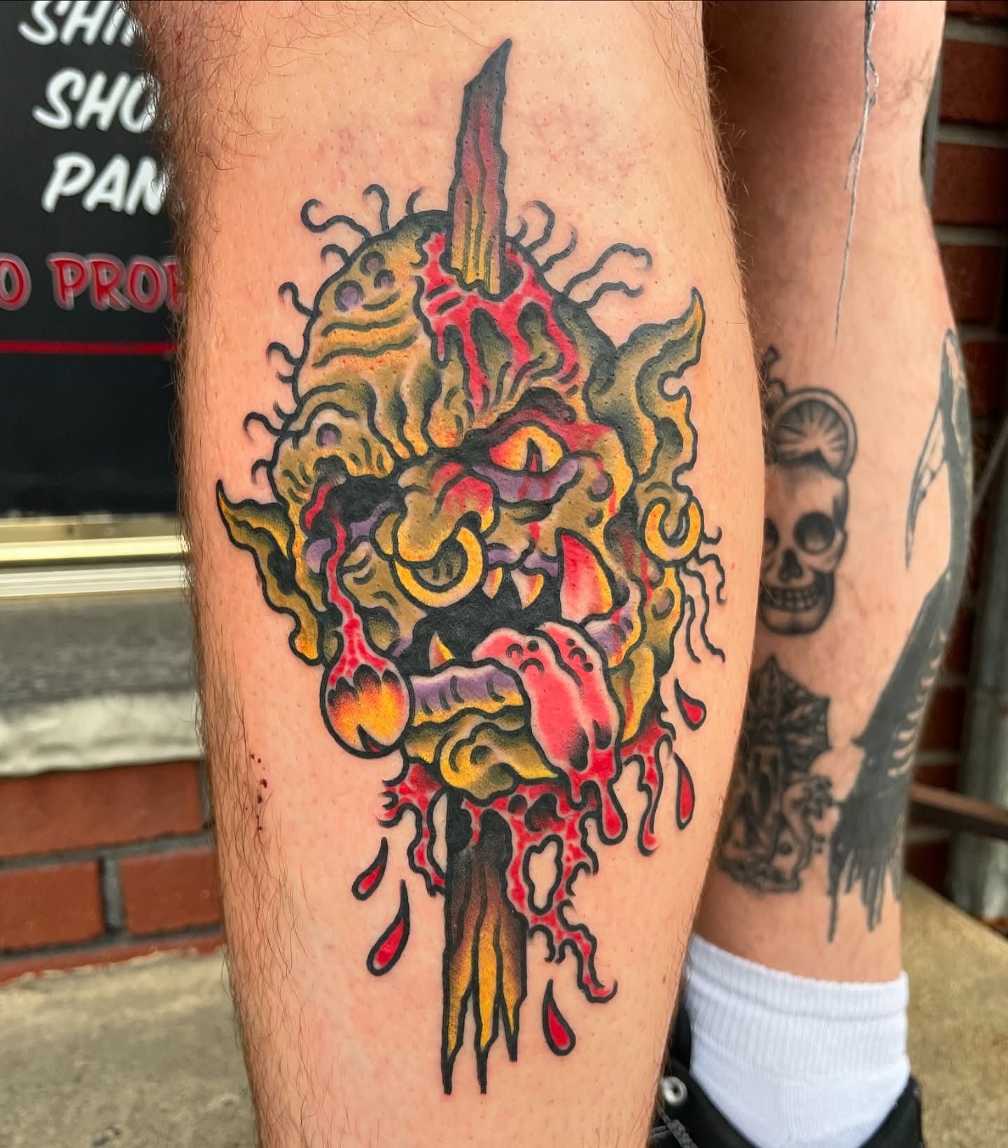 Demon American traditional tattoo on the leg by Tom Taylor, Philadelphia, Pennsylvania