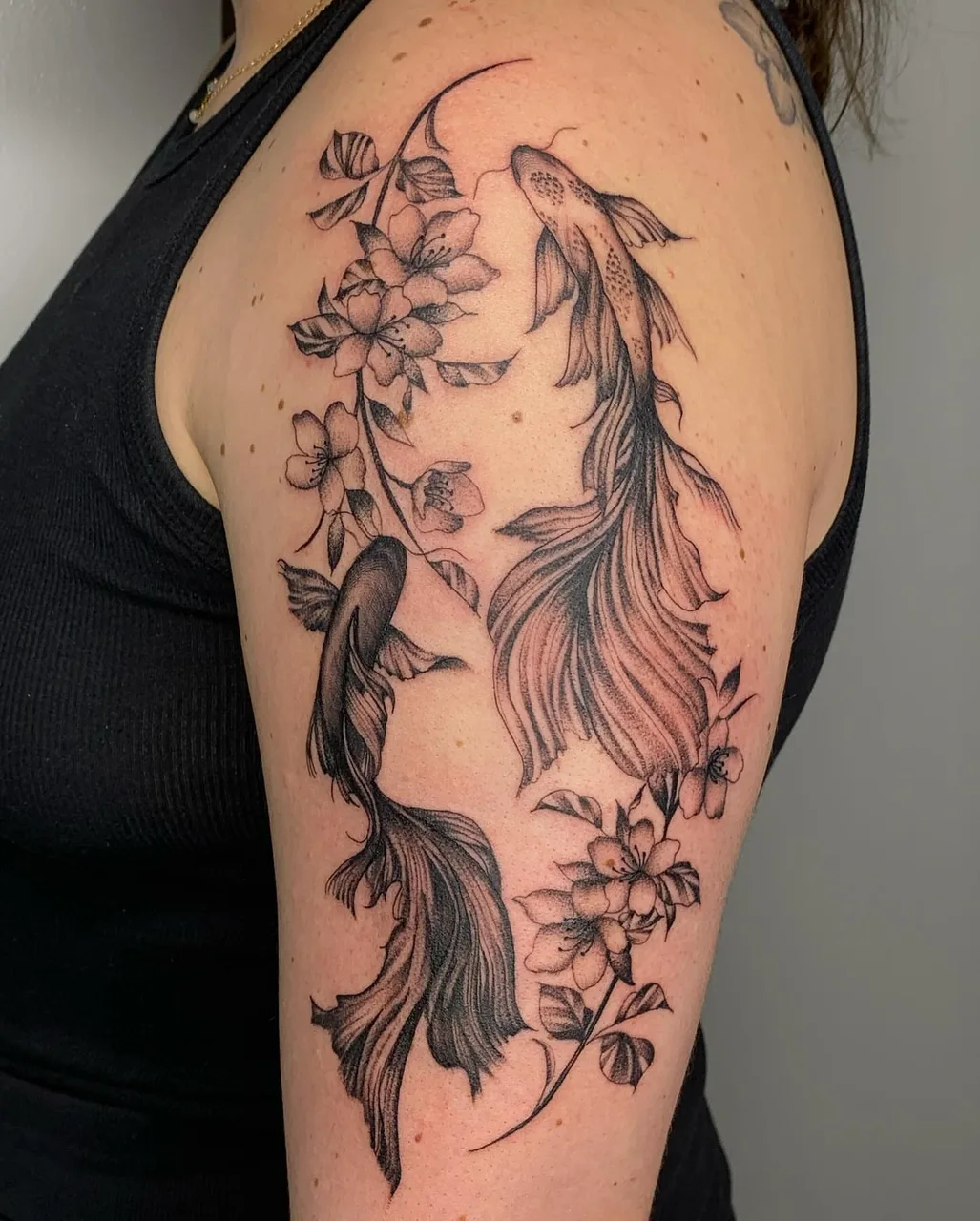 Koi fish and flowers realism tattoo on the shoulder by Savana ☆