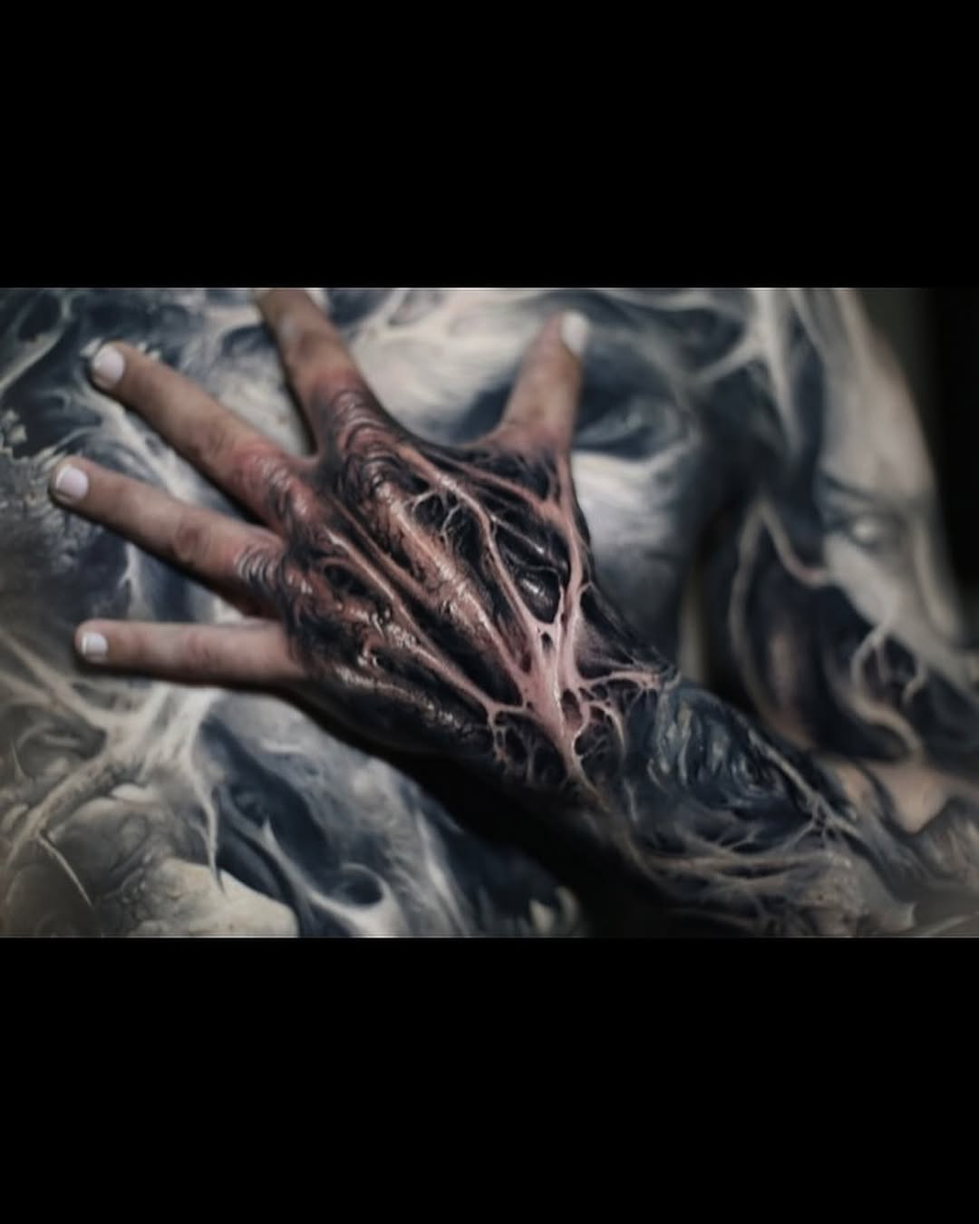Biomechanical hand and arm realism tattoo on the hand by David Jorquera