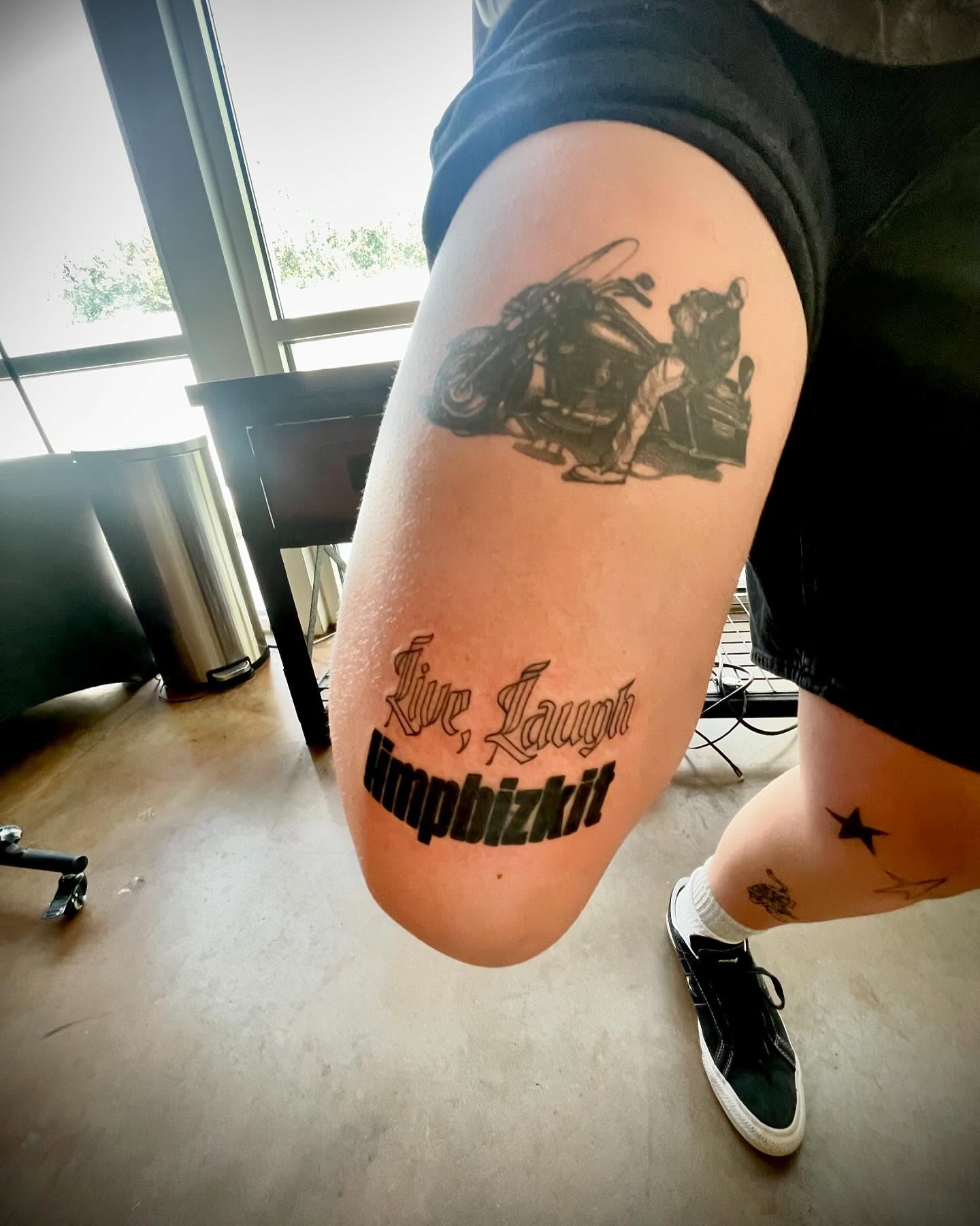 Motorcycle and rider black and grey tattoo on the thigh by Kaylee 🗡️