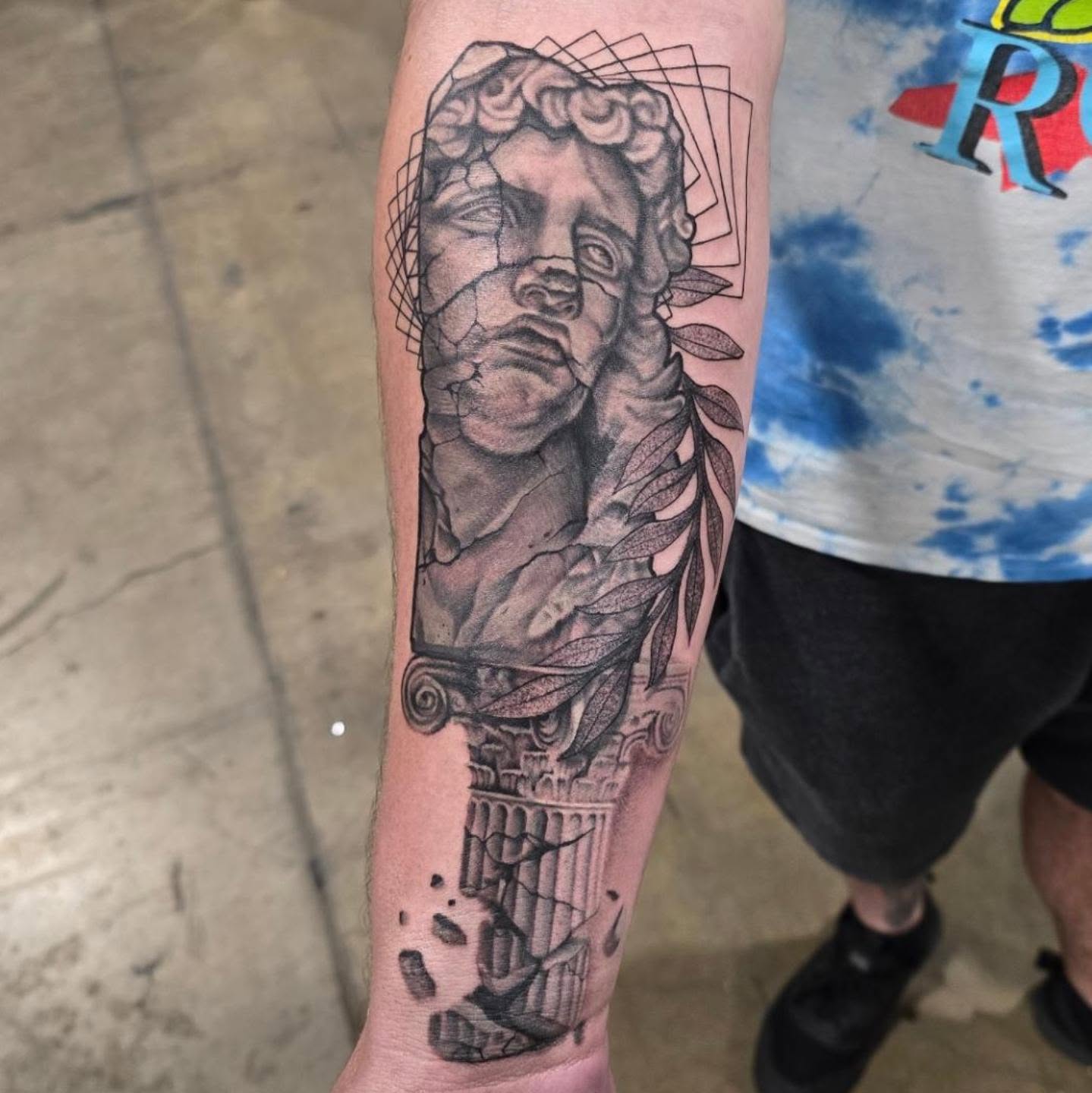 Statue head realism tattoo on the forearm by Lissy Red