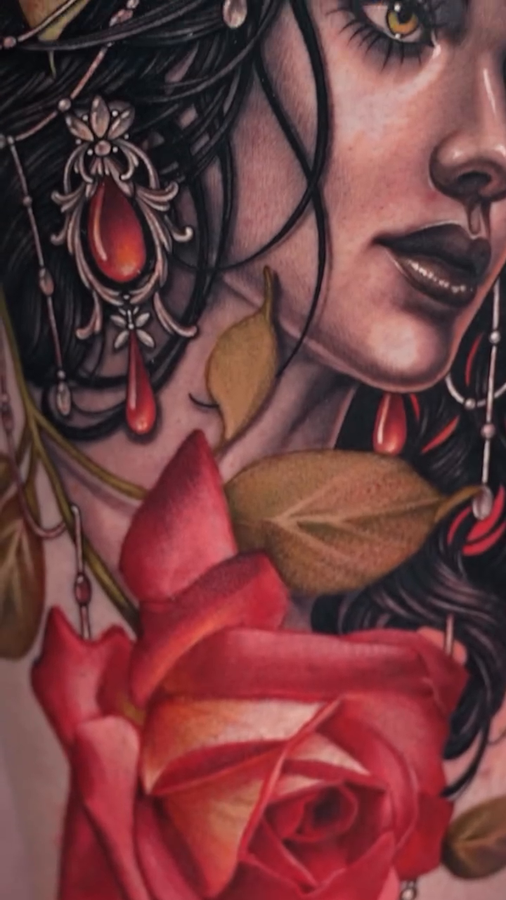 Woman with rose realism tattoo by Nikki Simpson