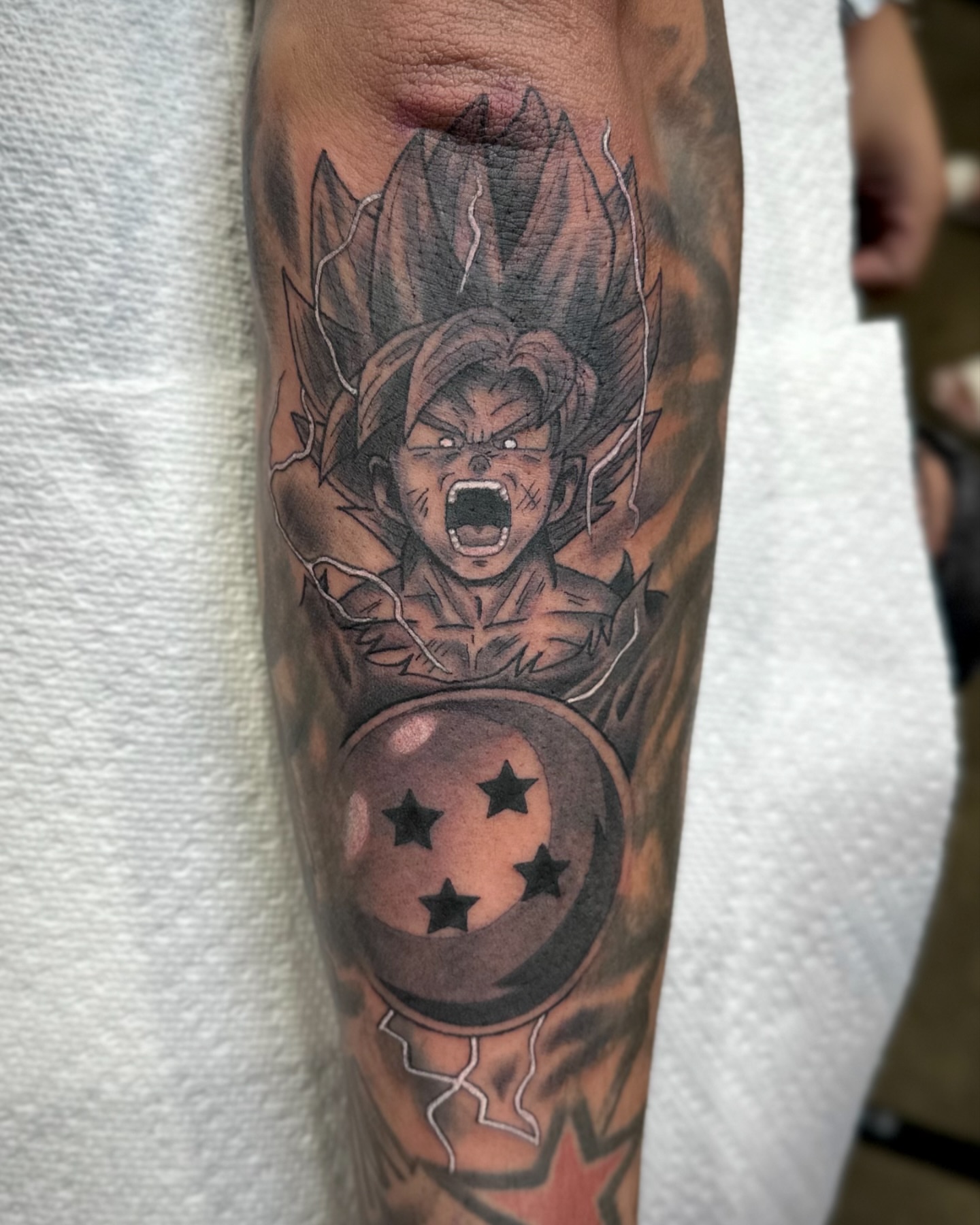 Dragon Ball Z character anime tattoo on the forearm by Savannah Compton