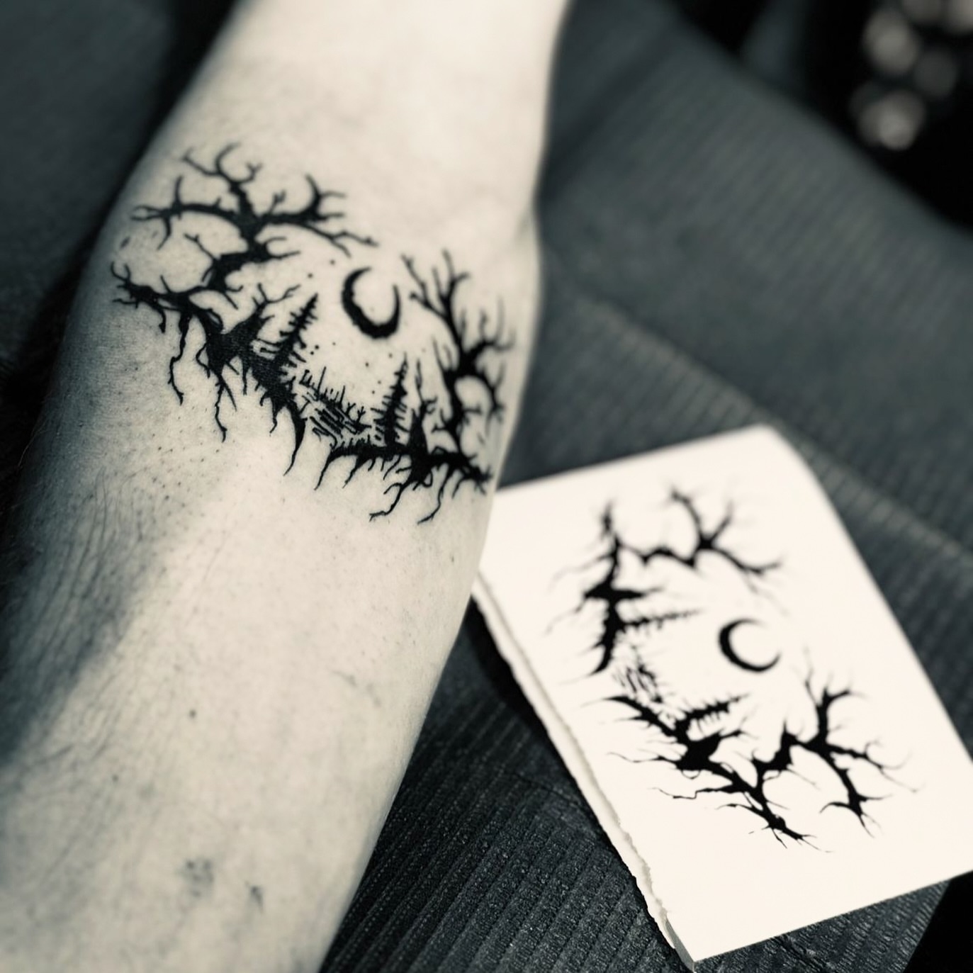 Tree and crescent moon black and grey tattoo on the forearm by James Hall