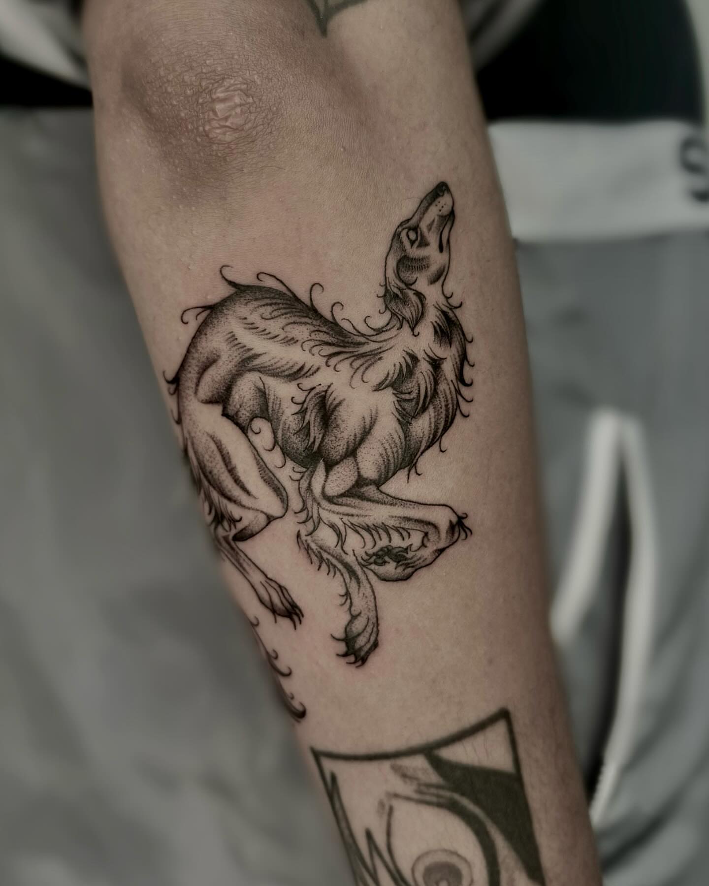Howling wolf dotwork tattoo on the forearm by Melanie