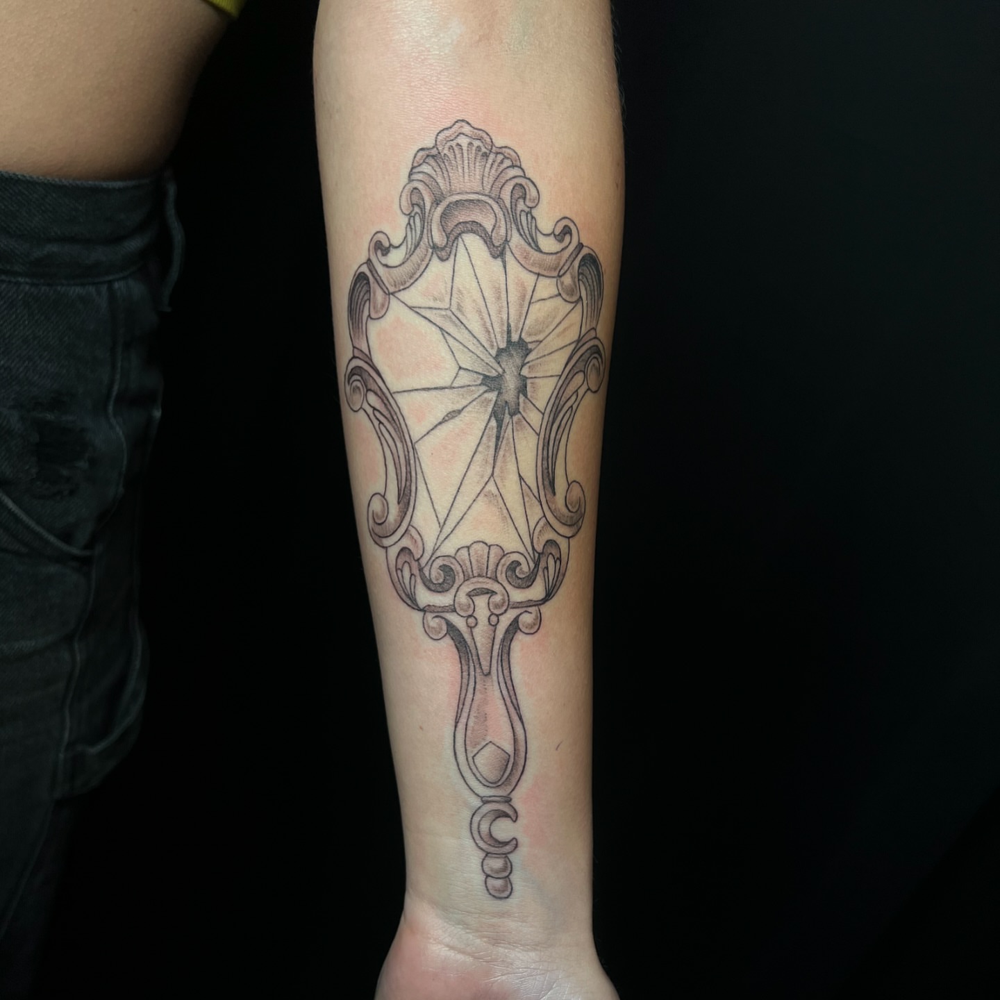 Compass black and grey tattoo on the forearm by Daphne Landry