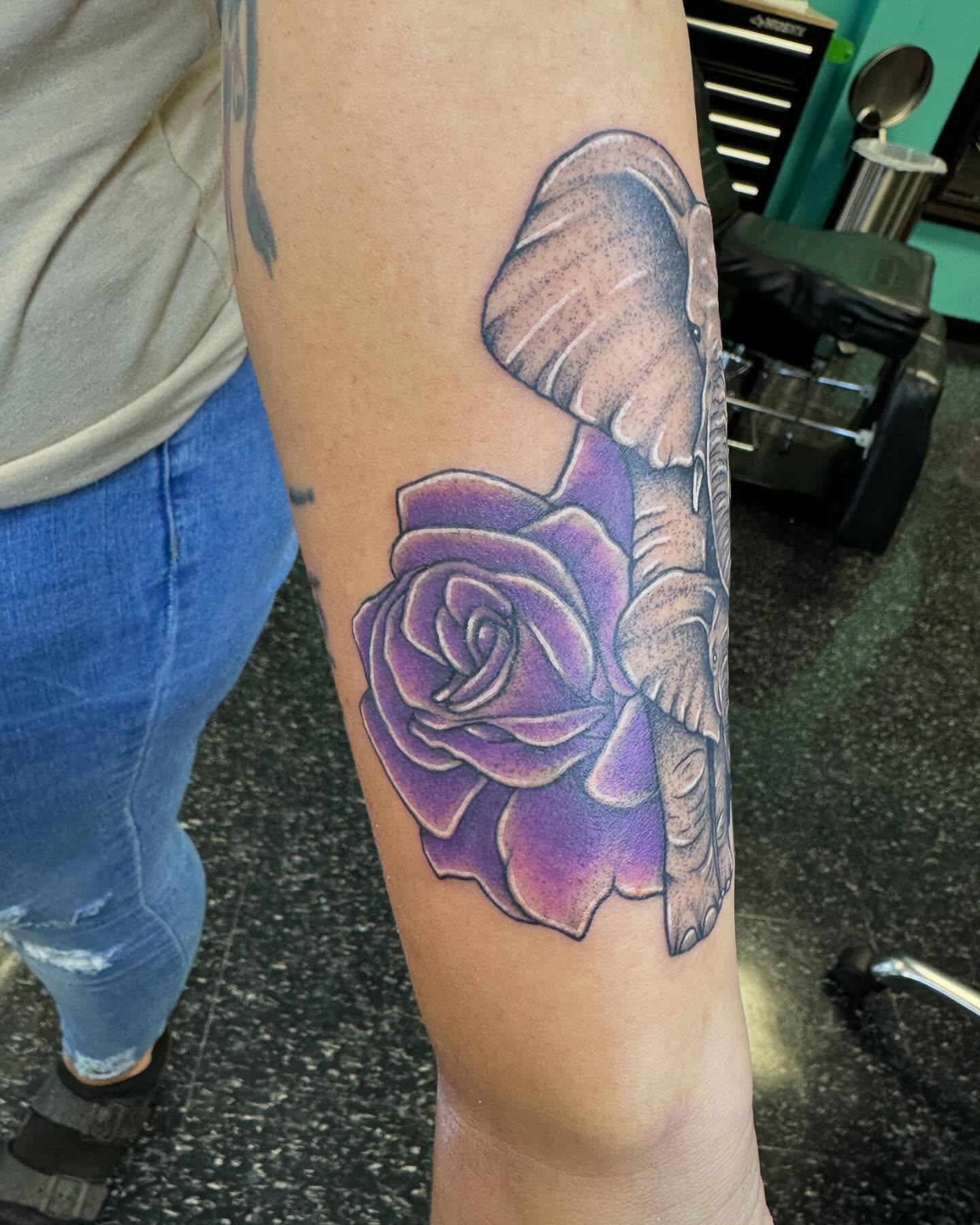 Purple rose realism tattoo on the forearm by Cory Perry-Servellon